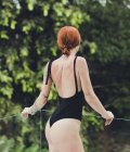 One-piece black swimsuit with ties One-piece black swimsuit with ties