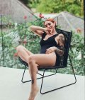 One-piece black swimsuit with ties One-piece black swimsuit with ties